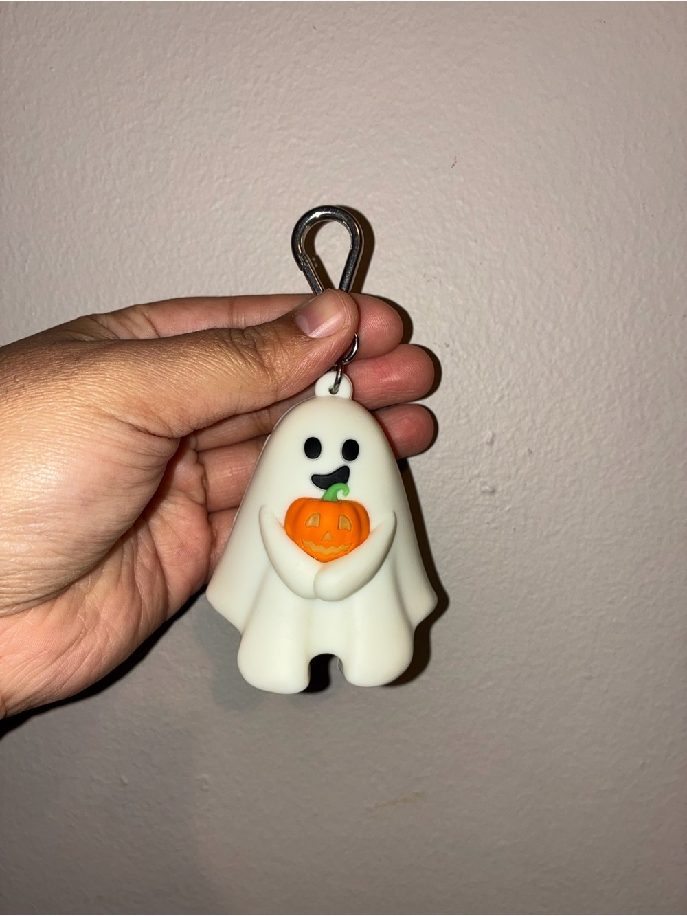 Ghost holding pumpkin hand sanitizer holder
